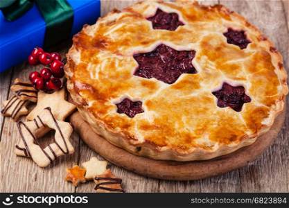 homemade cherry pie on a wooden table. homemade crust pie