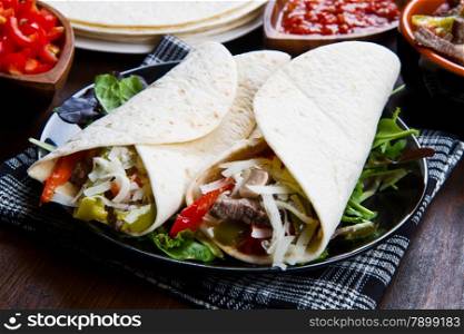 homemade Chicken and Beef Fajitas with Vegetables and Tortillas