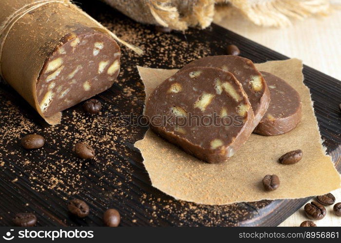 Homemade chocolate and coffee cookie treat. Chocolate sausage for dessert.