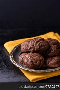Homemade chocolate cookies on metal plate, selective focus