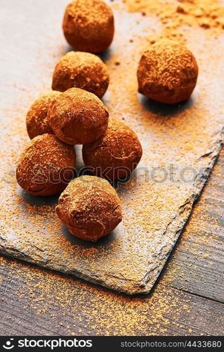 Homemade chocolate truffles on slate plate