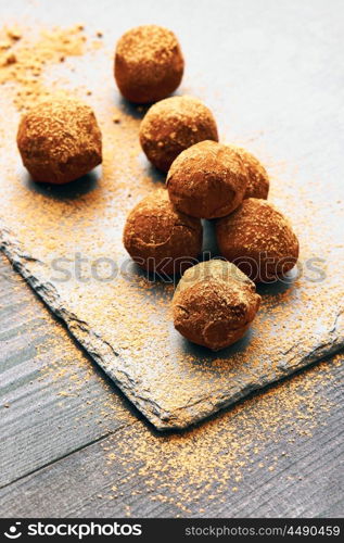 Homemade chocolate truffles on slate plate