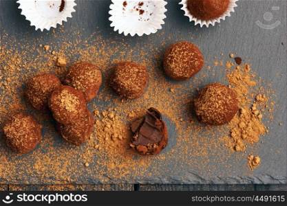 Homemade chocolate truffles on slate plate