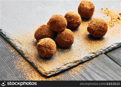 Homemade chocolate truffles on slate plate