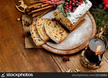 Homemade christmas cake with wild berries on woonen background. Homemade christmas cake with wild berries