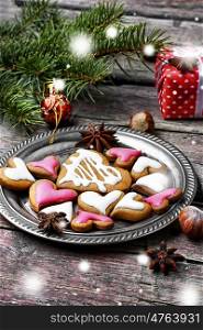 Homemade Christmas cookies in the shape of hearts on saucer. Loved Christmas cookies