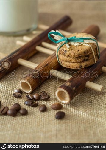 Homemade cookies,coffee beans and milk on gray background