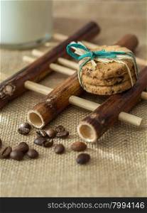 Homemade cookies,coffee beans and milk on gray background
