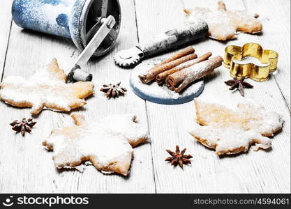Homemade cookies in the shape of maple leaf on the kitchen table, for the winter holidays