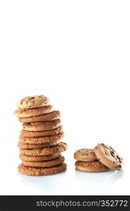 Homemade corded wholegrain cookies with oatmeal, linen and sesame seeds and traditional cookies with chocolate chips on a white background. Healthy vegan food concept.. Various shortbread, oat cookies, chocolate chip biscuit isolated on a white background.