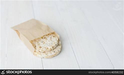 homemade crispy puffed rice brown paper bag white wooden desk