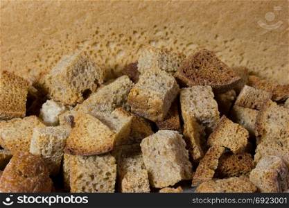 Homemade croutons on wooden background