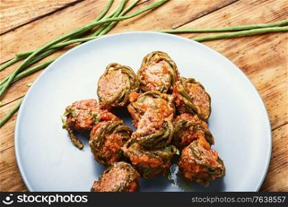 Homemade cutlets or meatballs,stewed with asparagus beans.. Meat cutlets and asparagus beans