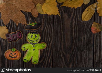 Homemade delicious ginger biscuits for Halloween. Homemade delicious ginger biscuits for Halloween on wooden table