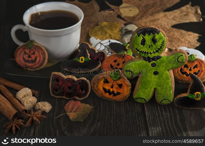 Homemade delicious ginger biscuits for Halloween. Homemade delicious ginger biscuits for Halloween on wooden table