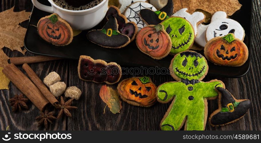 Homemade delicious ginger biscuits for Halloween. Homemade delicious ginger biscuits for Halloween on wooden table