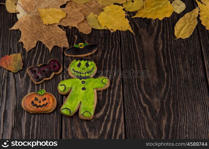 Homemade delicious ginger biscuits for Halloween. Homemade delicious ginger biscuits for Halloween on wooden table