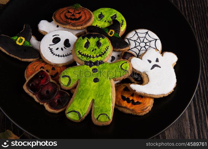 Homemade delicious ginger biscuits for Halloween. Homemade delicious ginger biscuits for Halloween on wooden table