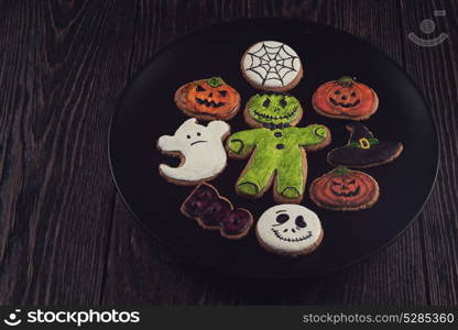 Homemade delicious ginger biscuits for Halloween. Homemade delicious ginger biscuits for Halloween on wooden table