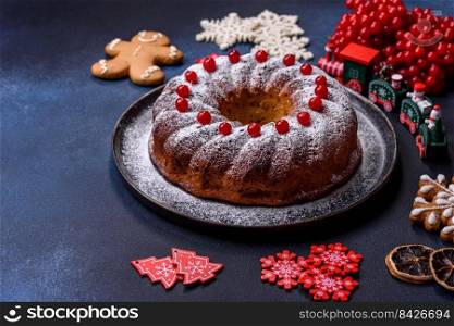 Homemade delicious round Christmas pie with red berries on a ceramic plate against a dark concrete background. Homemade delicious round Christmas pie with red berries on a ceramic plate