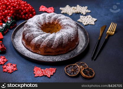 Homemade delicious round Christmas pie with red berries on a ceramic plate against a dark concrete background. Homemade delicious round Christmas pie with red berries on a ceramic plate