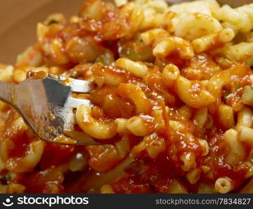 homemade elbow macaroni pasta with vegetable and tomato sauce