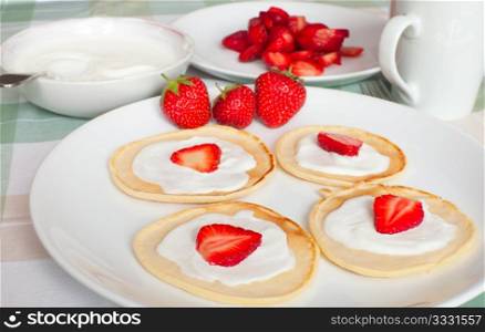 Homemade Flapjacks / Pancakes With Strawberries and Sweet Cream