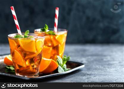 homemade flavored orange iced tea, refreshing summer beverage