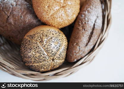 Homemade for Bakery and golden crusty breads in basket isolated on white background.