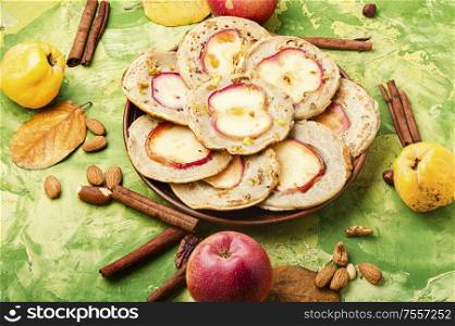 Homemade fried pancakes stuffed with apples.Autumn food. Fried pancakes with apples