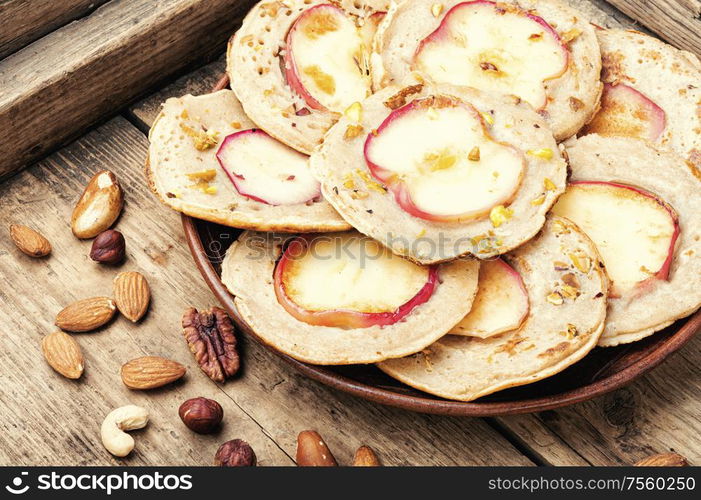 Homemade fried pancakes stuffed with apples.Autumn food. Fried pancakes with apples