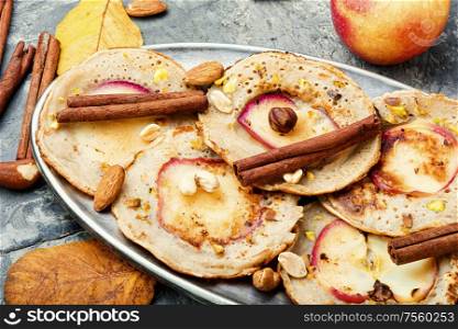 Homemade fried pancakes stuffed with apples.Autumn food. Fried pancakes with apples