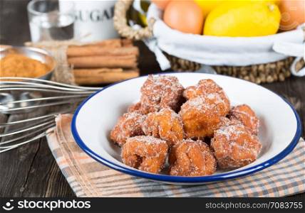 Homemade fritters with sugar and its ingredients