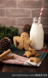Homemade gingerbread man cookies and milk, traditionally made at Christmas and the holidays.