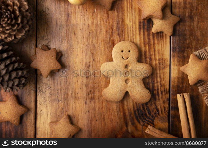 Homemade gingerbread man cookies, traditionally made at Christmas and the holidays. Table top view.