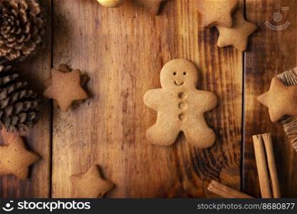 Homemade gingerbread man cookies, traditionally made at Christmas and the holidays. Table top view.