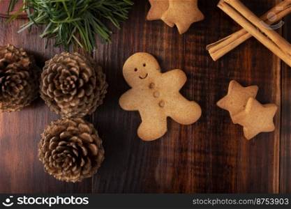 Homemade gingerbread man cookies, traditionally made at Christmas and the holidays. Table top view