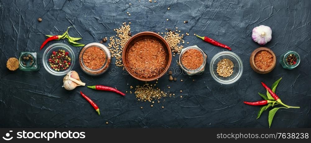 Homemade hot seasoning spice,dry adjika and ingredients. Dry adjika condiment
