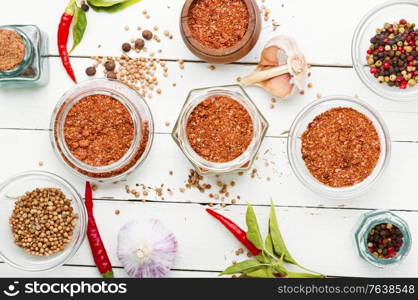 Homemade hot seasoning spice,dry adjika and ingredients. Dry adjika condiment