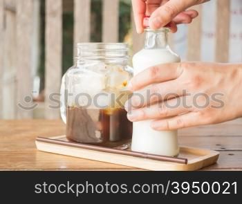 Homemade iced coffee ingredient on wooden table, stock photo