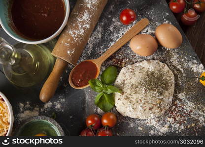 Homemade italian pizza preparation. Fresh an tasty homemade pizza preparation