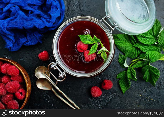 homemade jam in bank and fresh berries