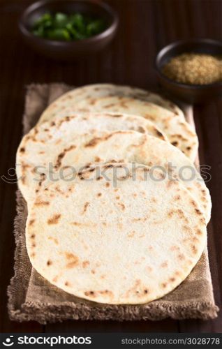 Homemade leavened Indian Naan flatbread (Selective Focus, Focus one third into the image). Homemade Leavened Indian Naan Flatbread