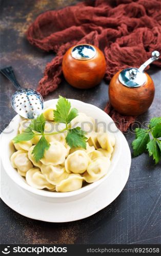 Homemade meat dumplings - russian pelmeni. Stock photo