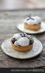 Homemade mini tart with blueberries and whipped cream . Homemade mini tart with blueberries 