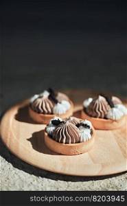 Homemade mini tart with chocolate and whipped cream. Homemade mini tart with chocolate