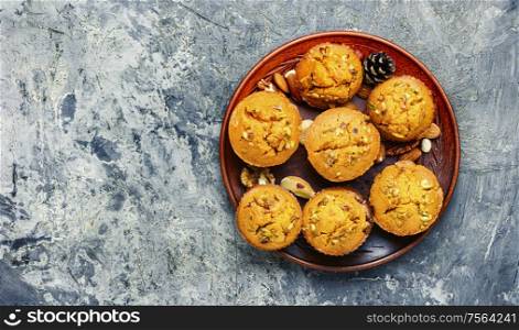 Homemade muffins with nuts on a plate.. Fragrant homemade cakes, muffins.