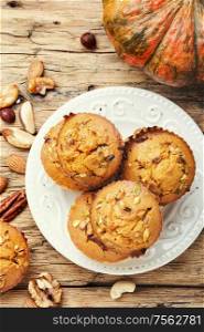 Homemade muffins with nuts on a plate.Nuts muffins. Fragrant homemade cakes, muffins.