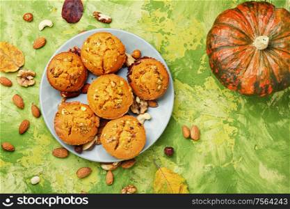 Homemade muffins with nuts on a plate.Nuts muffins. Fragrant homemade cakes, muffins.