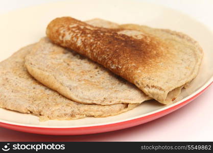 Homemade North Staffordshire oatcakes, a regional English delicacy with something approaching a cult following. These pancakes are unusual as they mix white, wholemeal and oatmeal flour and are leavened with yeast rather tham using baking powder or soda.